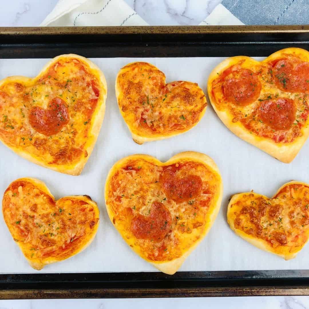 Mini Heart Shaped Pizzas, a really simple recipe idea for making a Valentines Day or romantic pizza. Low carb option.