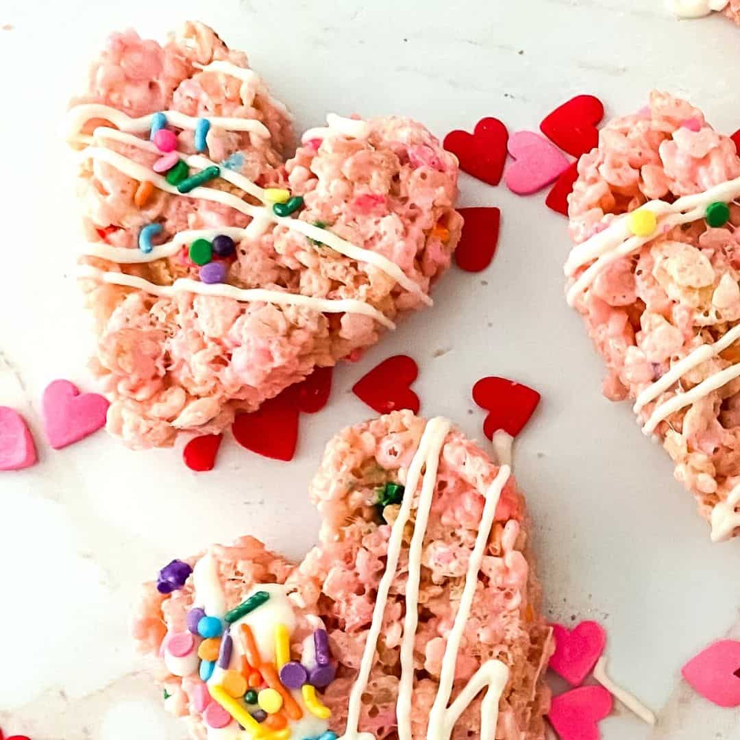 Valentines Day Rice Krispie Heart Treats, a recipe for a heart shaped dessert or snack made with cereal and marshmallows.