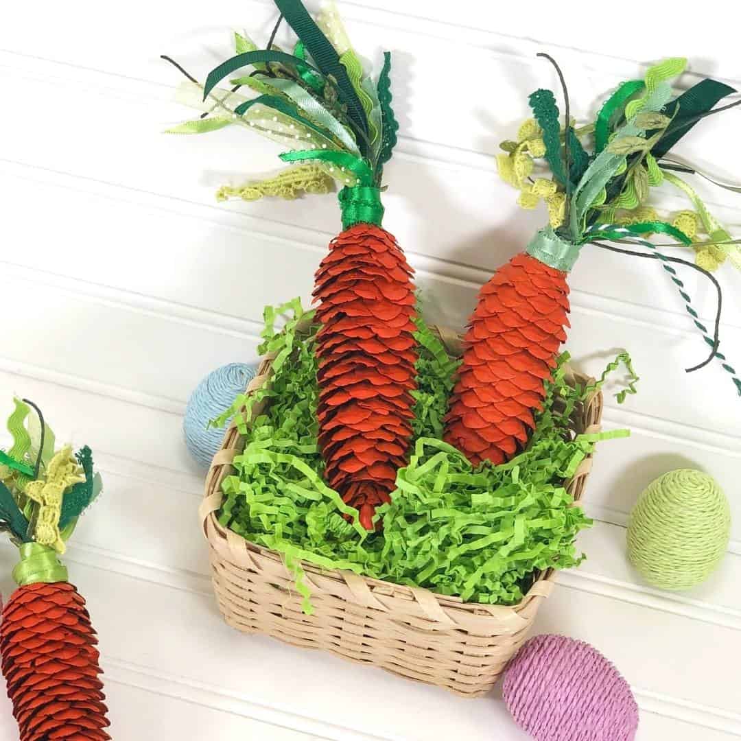 Pine Cone Carrot Craft DIY, a simple project for how to turn a pine cone into a carrot. This craft project is suitable for most ages.