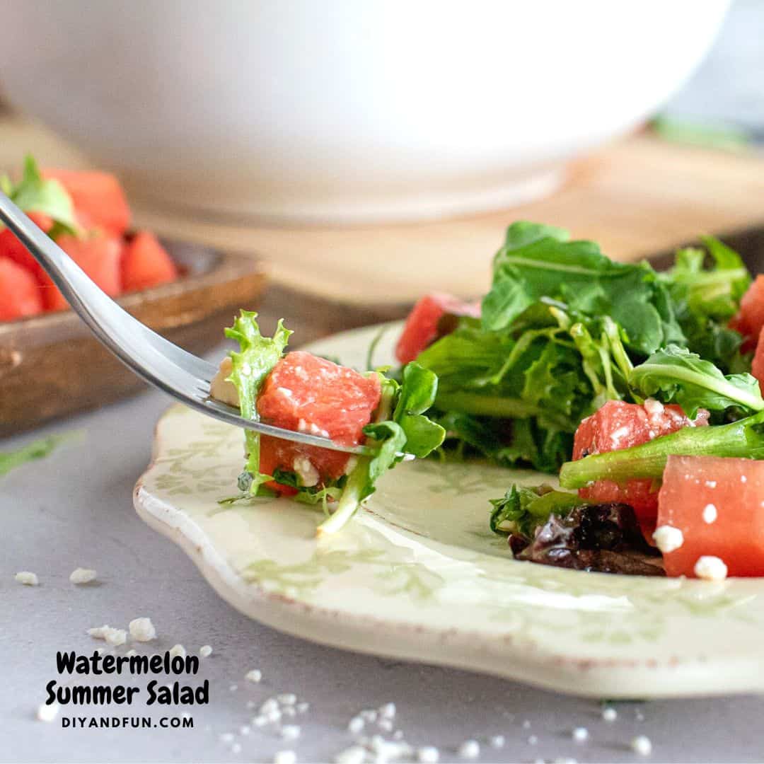 Watermelon Summer Salad, a simple four ingredient salad recipe tossed in homemade Raspberry Balsamic Vinaigrette dressing.