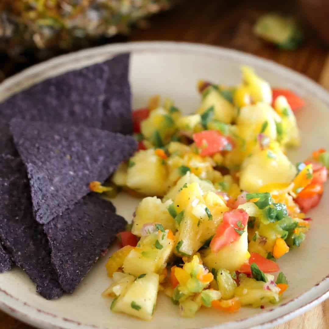 Easy and Delicious Pineapple Salsa, a simple recipe that is loaded with healthy peppers, tomatoes, and tasty salsa ingredients.