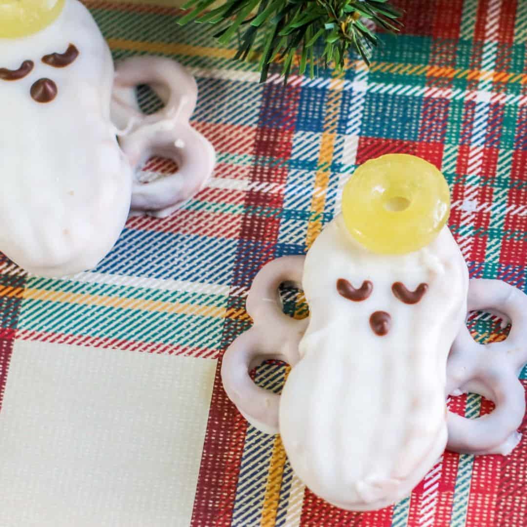 Nutter Butter Angel Cookies, a simple DIY recipe idea for decorating cookies with white chocolate to look like Christmas Angels