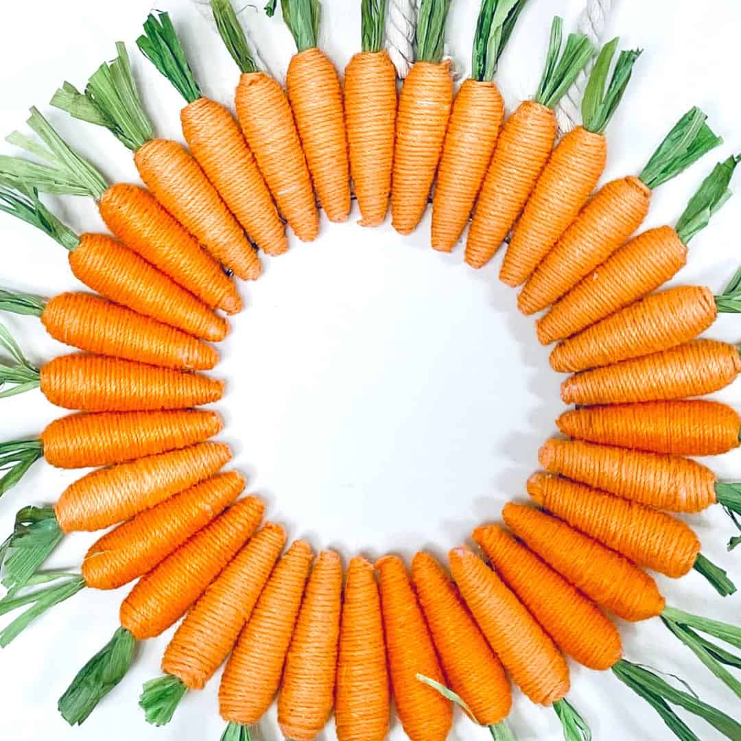 Easy Easter Carrot Wreath DIY, a simple spring craft diy idea that can be made with dollar store materials in less than a half hour.