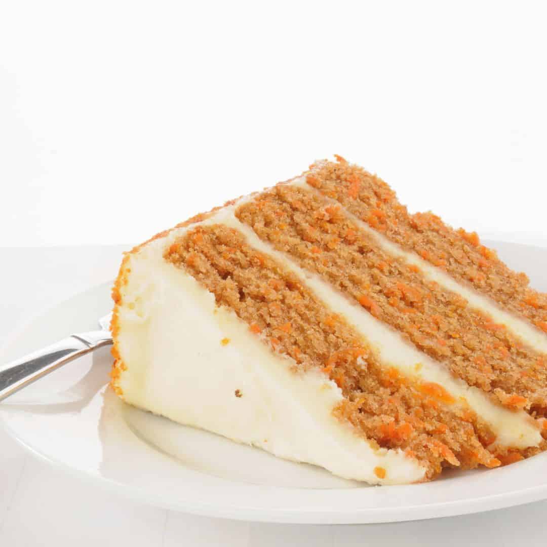 Simple Layered Carrot Cake Recipe, a delicious moist and flavorful cake dessert made with fresh carrots and cream cheese frosting.