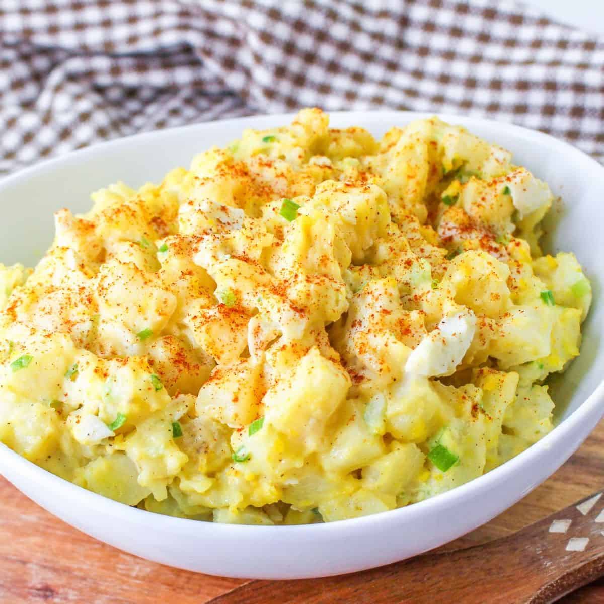Easy Deviled Egg Potato Salad recipe, a delicious twist  on a popular recipe, featuring  the bold taste of seasoned deviled eggs with potatoes.