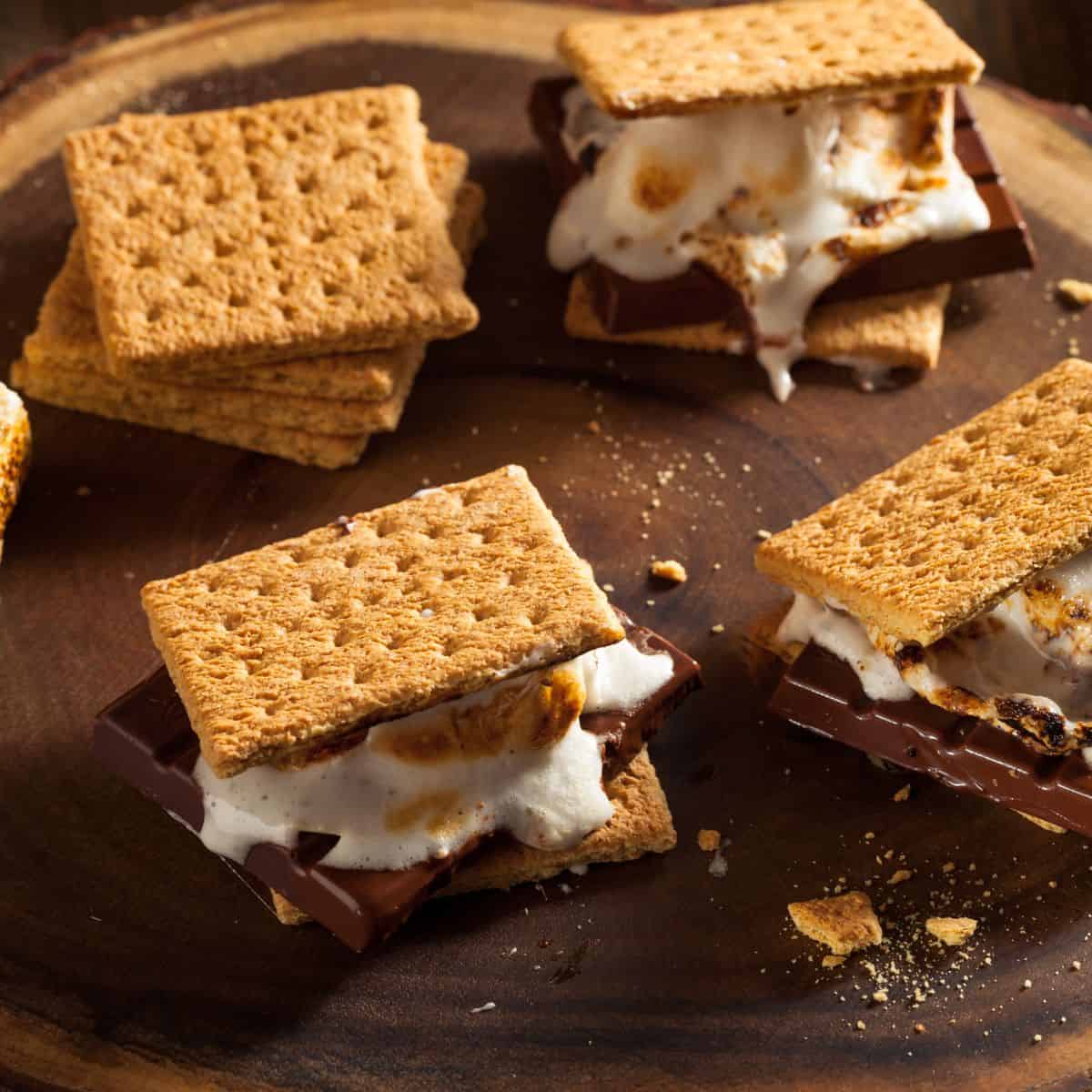 How to make a Campfire Charcuterie Board, Includes recipes for S'mores board,  S'mores stuffed campfire cones, and patriotic cones.