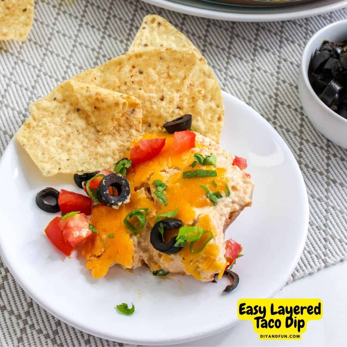 Easy Layered Taco Dip Recipe, a quick, simple and flavorful warm appetizer recipe that is perfect with tortilla chips or fresh vegetables