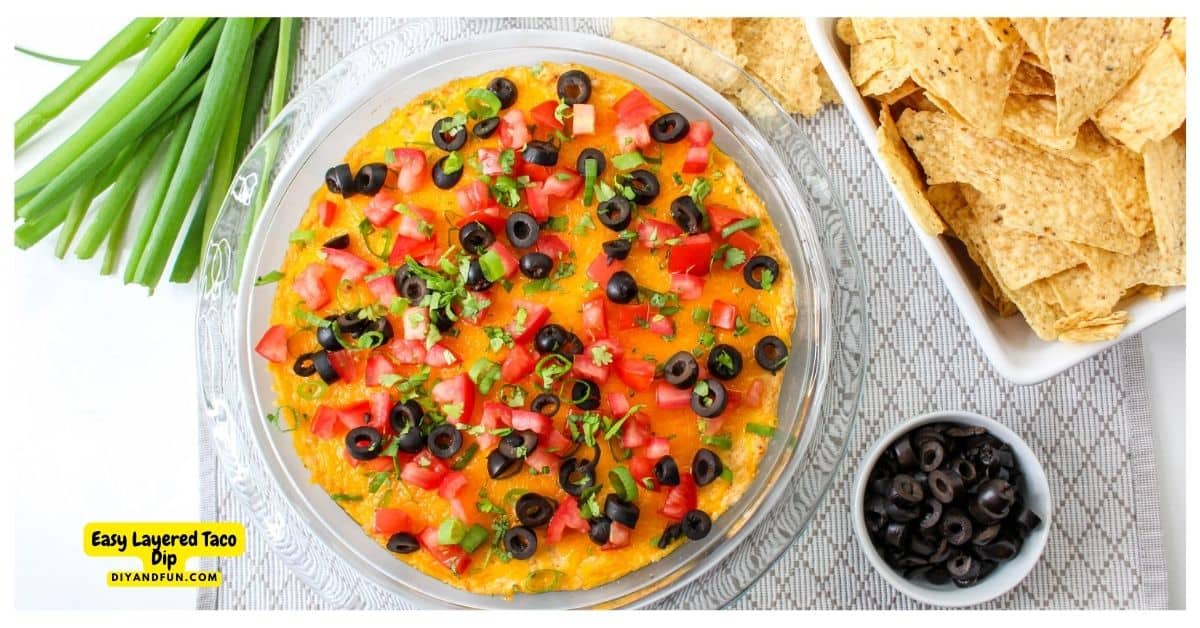 Easy Layered Taco Dip Recipe, a quick, simple and flavorful warm appetizer recipe that is perfect with tortilla chips or fresh vegetables