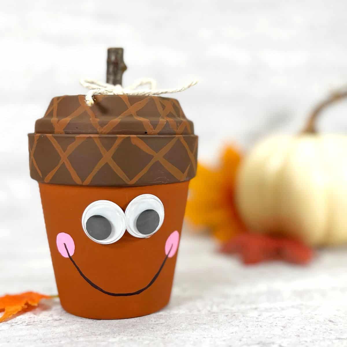 Clay Pot Acorn Craft DIY, an easy fall inspired do it yourself project made with dollar store materials, terracotta pot. Most ages 