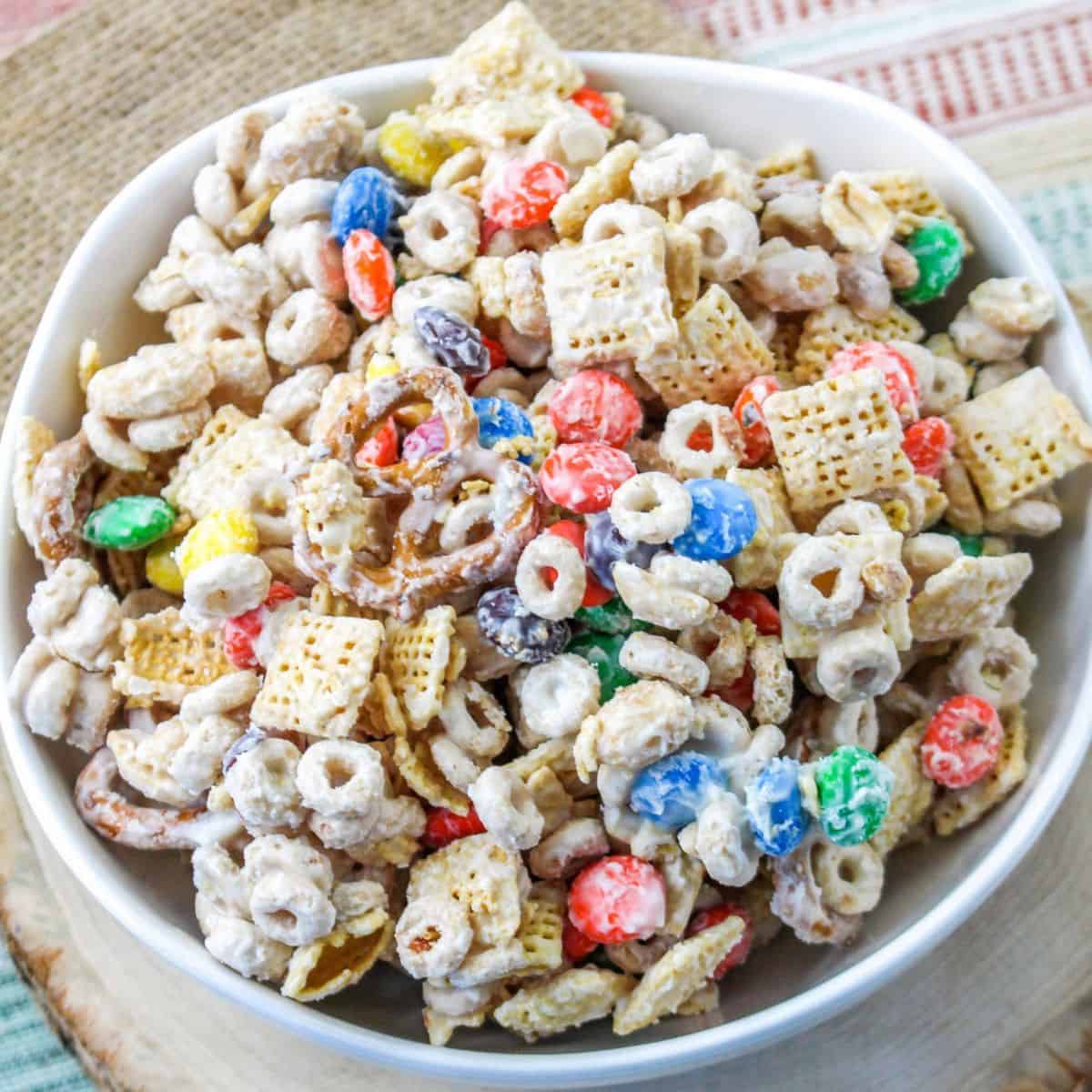 Easy White Chocolate Snack Mix, a simple and delicious sweet, salty, and crunchy recipe made with cereal, candy, pretzels, and nuts.
