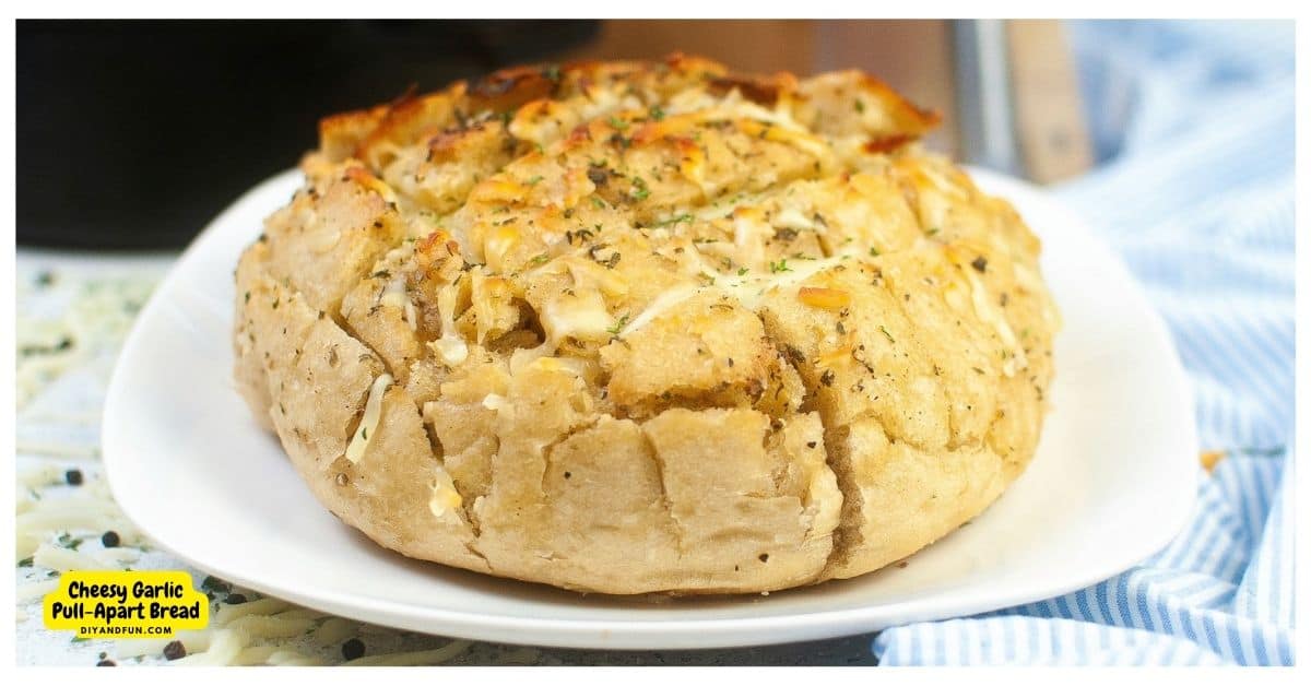 Cheesy Garlic Pull-Apart Bread Recipe, a delicious and easy appetizer recipe featuring gooey warm cheese and fresh garlic.