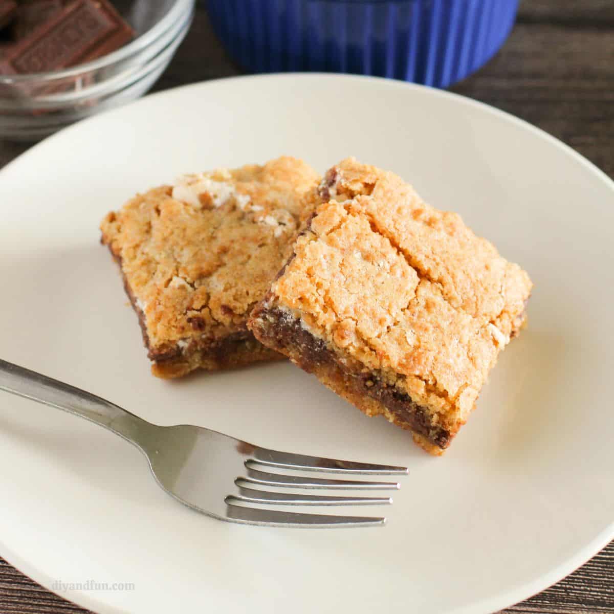 S’More Cookie Bars Recipe, a simple and delicious oven baked dessert recipe made with graham crackers, chocolate bars, and marshmallows. S’More Cookie Bars Recipe, a simple and delicious oven baked dessert recipe made with graham crackers, chocolate bars, and marshmallows.