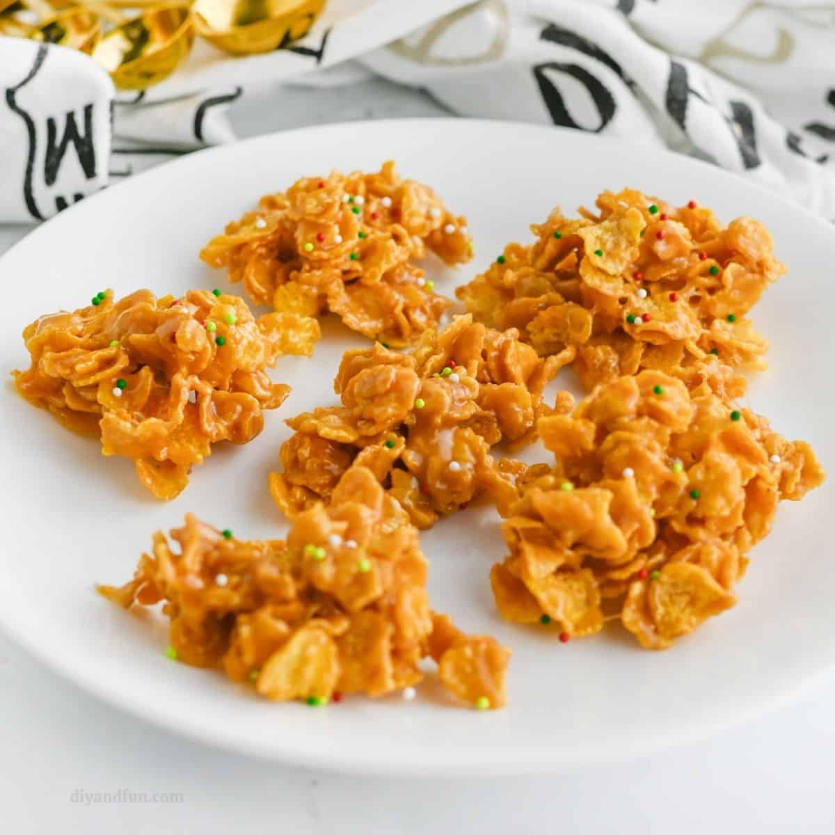 5 Ingredient Cornflake Candy, an easy to make no bake treat recipe featuring crunchy cereal with a chewy peanut butter coating. 5 Ingredient Cornflake Candy, an easy to make no bake treat recipe featuring crunchy cereal with a chewy peanut butter coating.