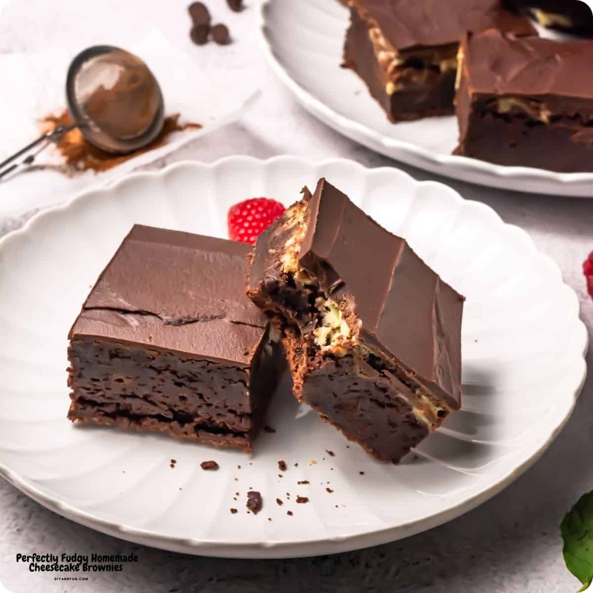 Perfectly Fudgy Homemade Cheesecake Brownies, a decadent, triple-layer dessert featuring a cheesecake center topped with chocolate ganache. Perfectly Fudgy Homemade Cheesecake Brownies, a decadent, triple-layer dessert featuring a cheesecake center topped with chocolate ganache.