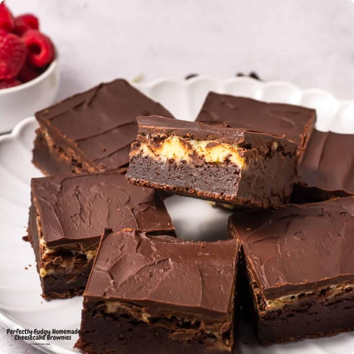 Perfectly Fudgy Homemade Cheesecake Brownie, a decadent, triple-layer dessert featuring a cheesecake center topped with chocolate ganache. Perfectly Fudgy Homemade Cheesecake Brownies, a decadent, triple-layer dessert featuring a cheesecake center topped with chocolate ganache.