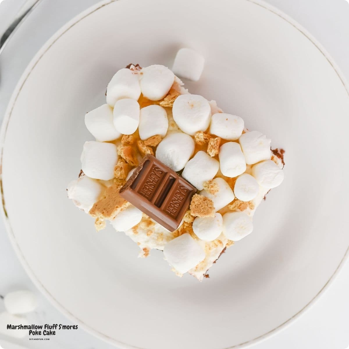 Marshmallow Fluff S'mores Poke Cake, the ultimate easy dessert made with chocolate cake, rich pudding, and fluffy frosting. Marshmallow Fluff S'mores Poke Cake, the ultimate easy dessert made with chocolate cake, rich pudding, and fluffy frosting.
