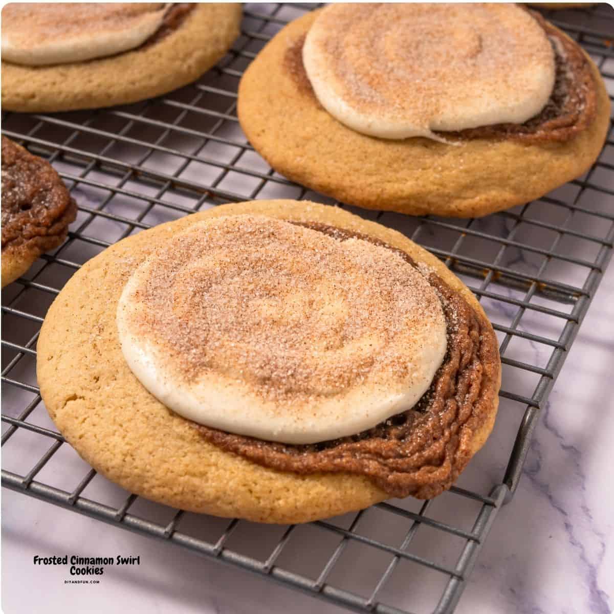 Frosted Cinnamon Swirl Cookies, delicious soft and buttery bakery-style cookies topped with creamy frosting and cinnamon sugar. Frosted Cinnamon Swirl Cookies, delicious soft and buttery bakery-style cookies topped with creamy frosting and cinnamon sugar.