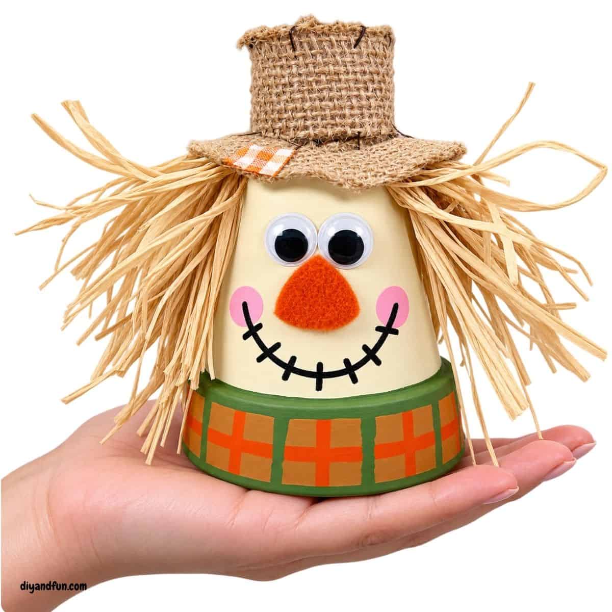 adorable DIY Clay Pot Scarecrow adorable DIY Clay Pot Scarecrow with simple Dollar Store supplies. This easy step-by-step fall craft is perfect for autumn decorating.