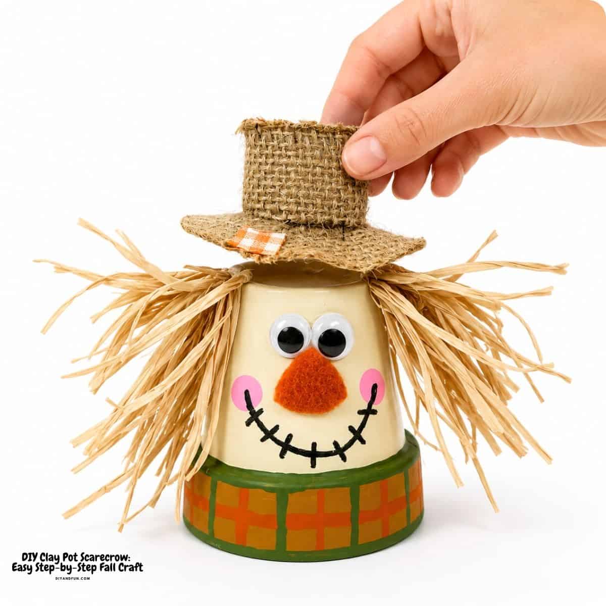 adorable DIY Clay Pot Scarecrow adorable DIY Clay Pot Scarecrow with simple Dollar Store supplies. This easy step-by-step fall craft is perfect for autumn decorating.